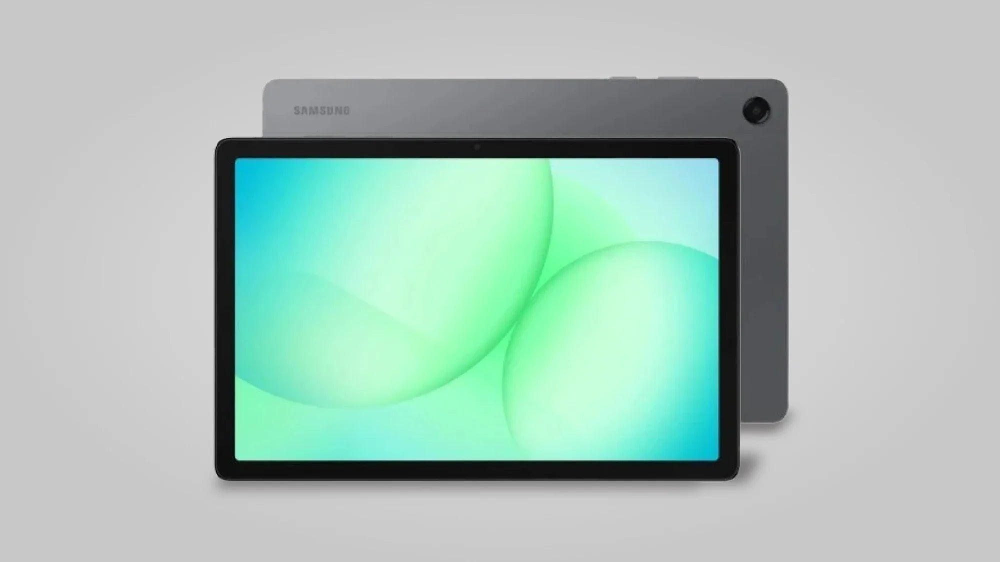 A black Samsung tablet with a bright green and blue screen is shown in front of another grey tablet, both displayed against a plain light grey background.
