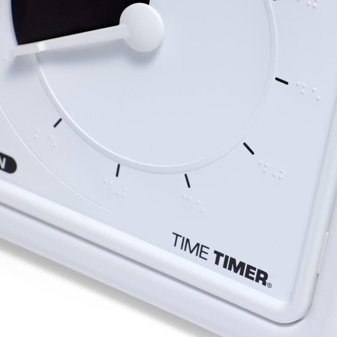 Close-up of the Time Timer Braille (8 Inch) [Black Disk] by Time Timer—a white clock with black tick marks, tactile braille dots, and "TIME TIMER" on the lower right. The minute hand is near zero. This tactile timer is effective assistive technology.