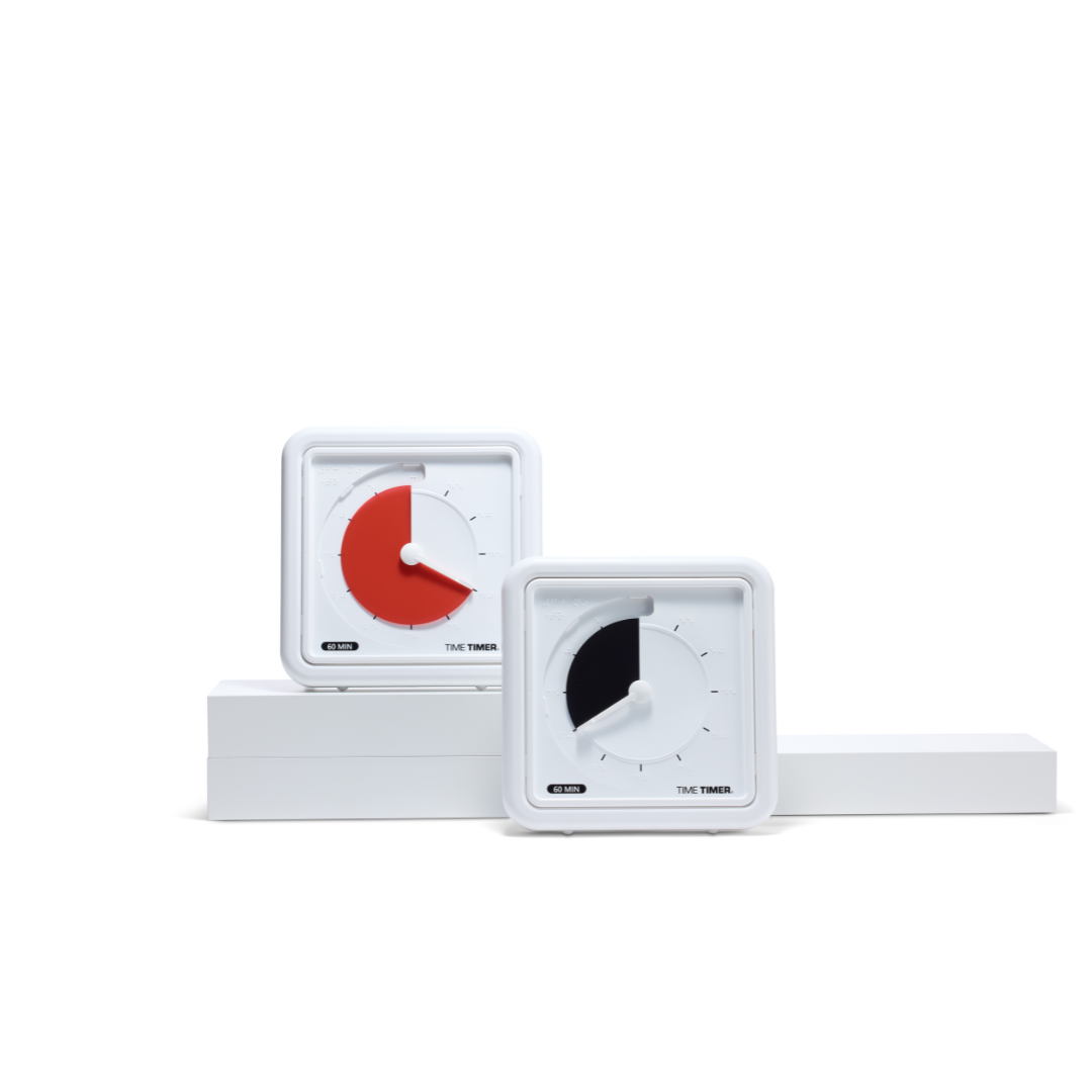 Two white, square Time Timer Braille (8 Inch) timers by Time Timer, each with a visible red countdown disk and braille markings, are displayed on white blocks against a plain background, showing different remaining times.