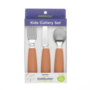 The KiddiKutter Kids Cutlery Set [Peach Fuzz] includes a fork, knife, and spoon with brown handles for self-feeding. The purple and white packaging features the KiddiKutter brand and the slogan "Cuts food, not fingers.