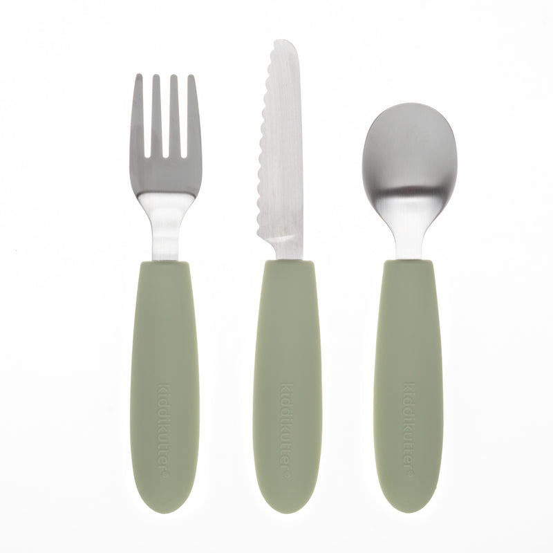 The KiddiKutter Kids Cutlery Set [Sage] by KiddiKutter includes a fork, serrated knife, and spoon with sage handles—ideal for encouraging self-feeding skills. Arranged side by side on a white background.