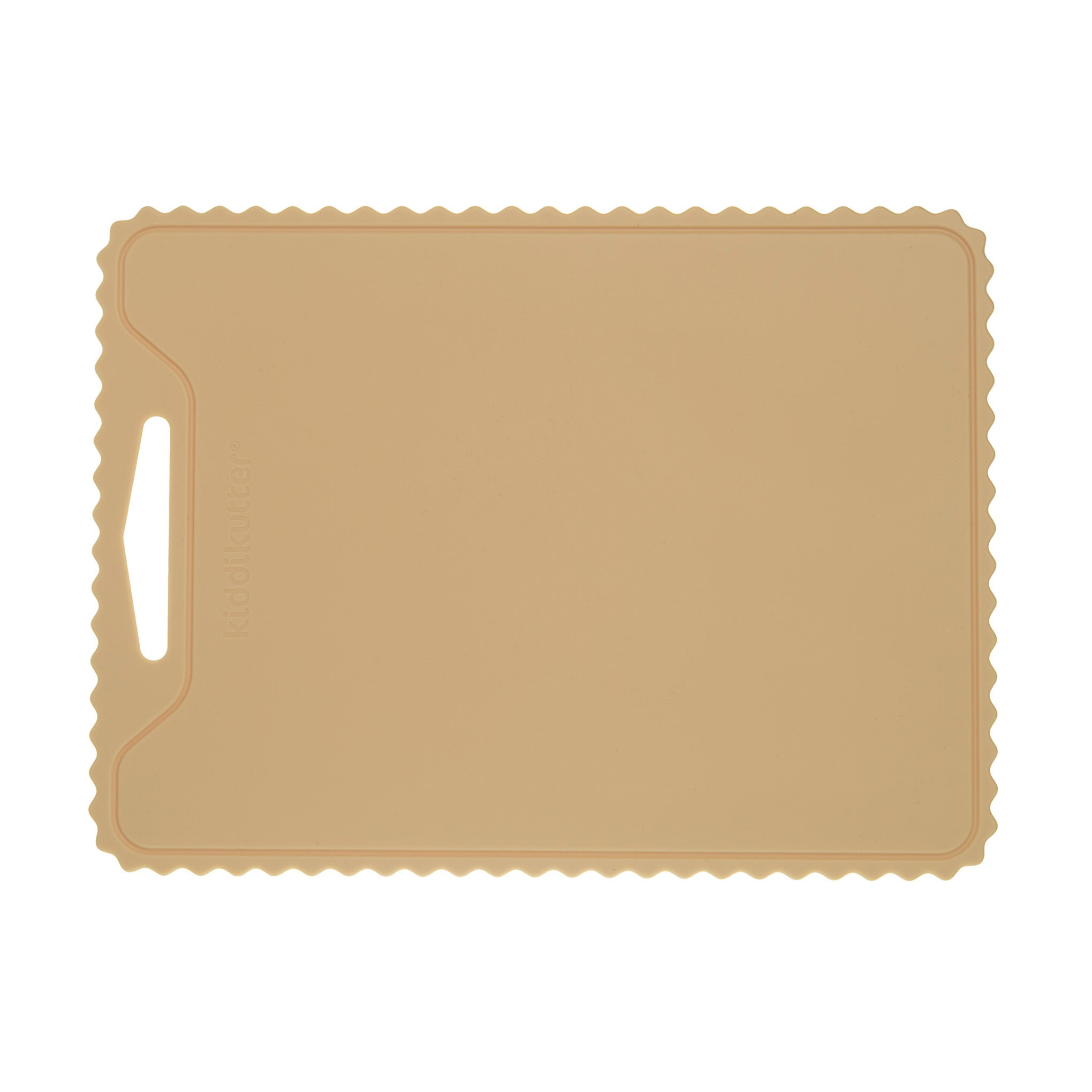 The KiddiKutter Silicone Cutting Board (Wavy) in cream by KiddiKutter features a rectangular, non-slip design with scalloped edges and a handle slot on the left, shown against a white background.