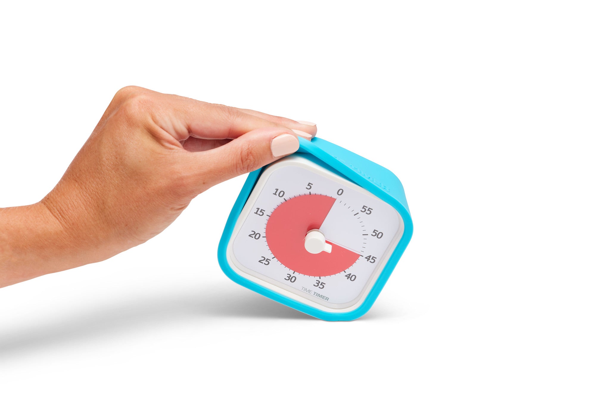 A hand tilts the Time Timer MOD [Sky Blue] (60 min) by Time Timer, with a red dial set to 35 minutes, encased in a blue silicone case against a white background.