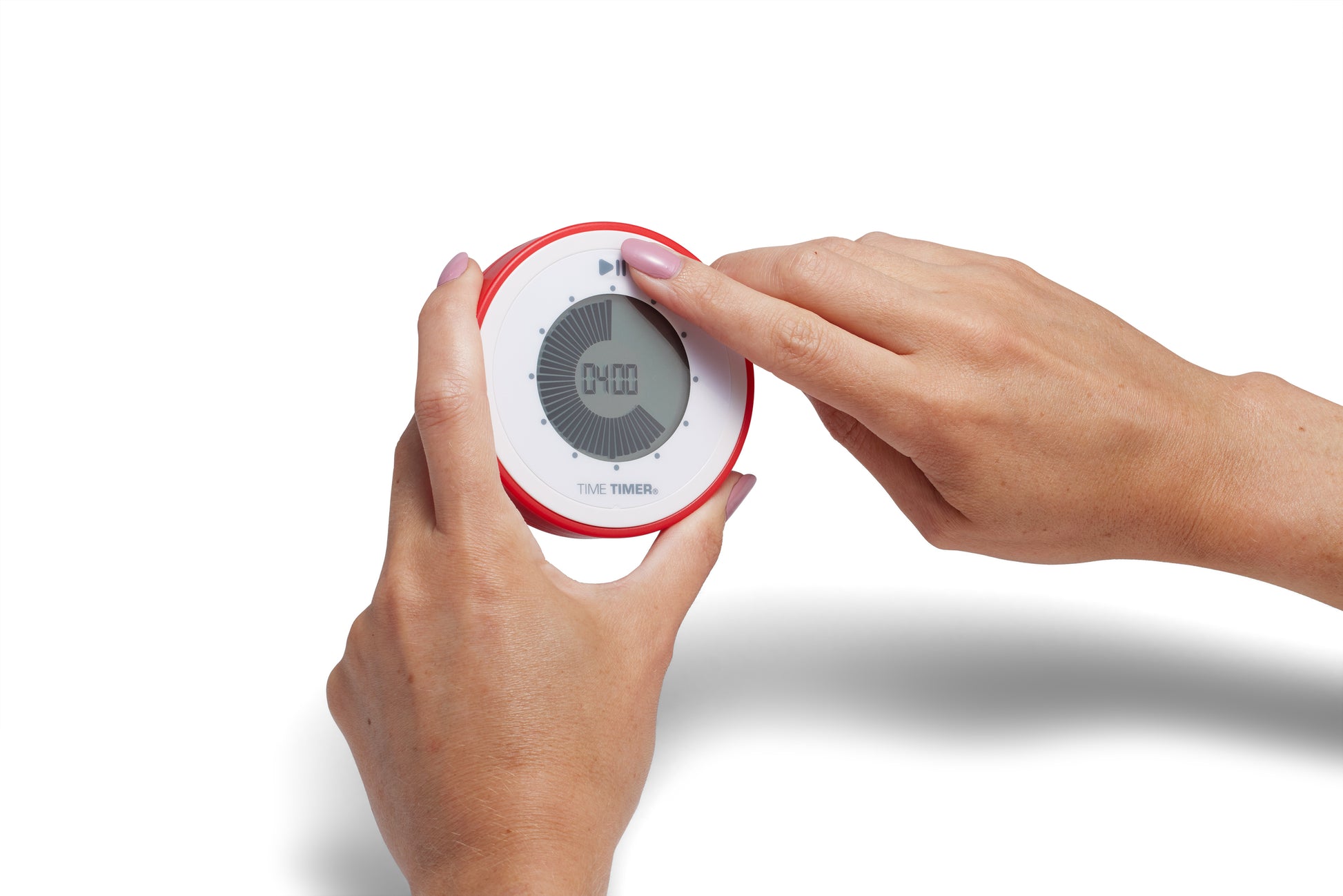 A person sets the red Time Timer Twist with Kickstand by Time Timer using their right hand while holding the magnetic timer in their left; its digital screen shows 0:00.