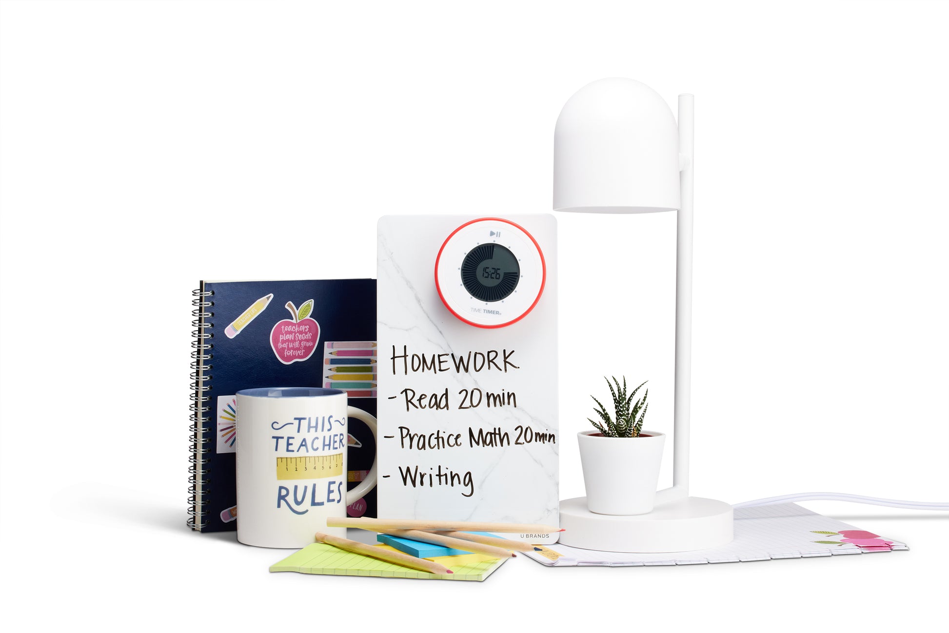 A desk setup featuring a notebook, a "THIS TEACHER RULES" mug, colored pens, the Time Timer Twist with Kickstand (Red) by Time Timer, a homework whiteboard, a potted plant, and a modern white desk lamp.