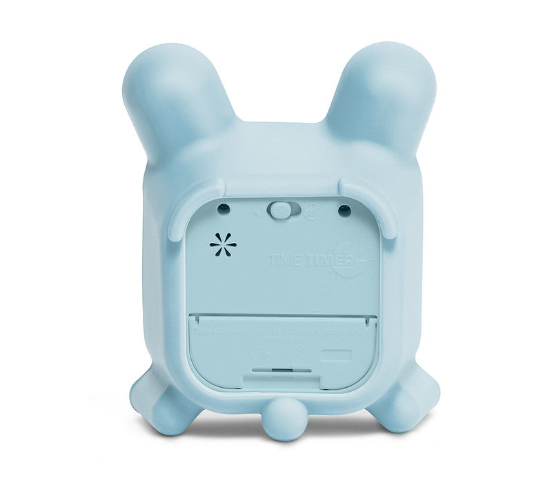 The Time Timer MOD + Protect Case – Bunny (60 min) by Time Timer is shown from the back in light blue with a bunny-shaped silicone case, two rounded ears, four short legs, a battery compartment, and a circular speaker grill.