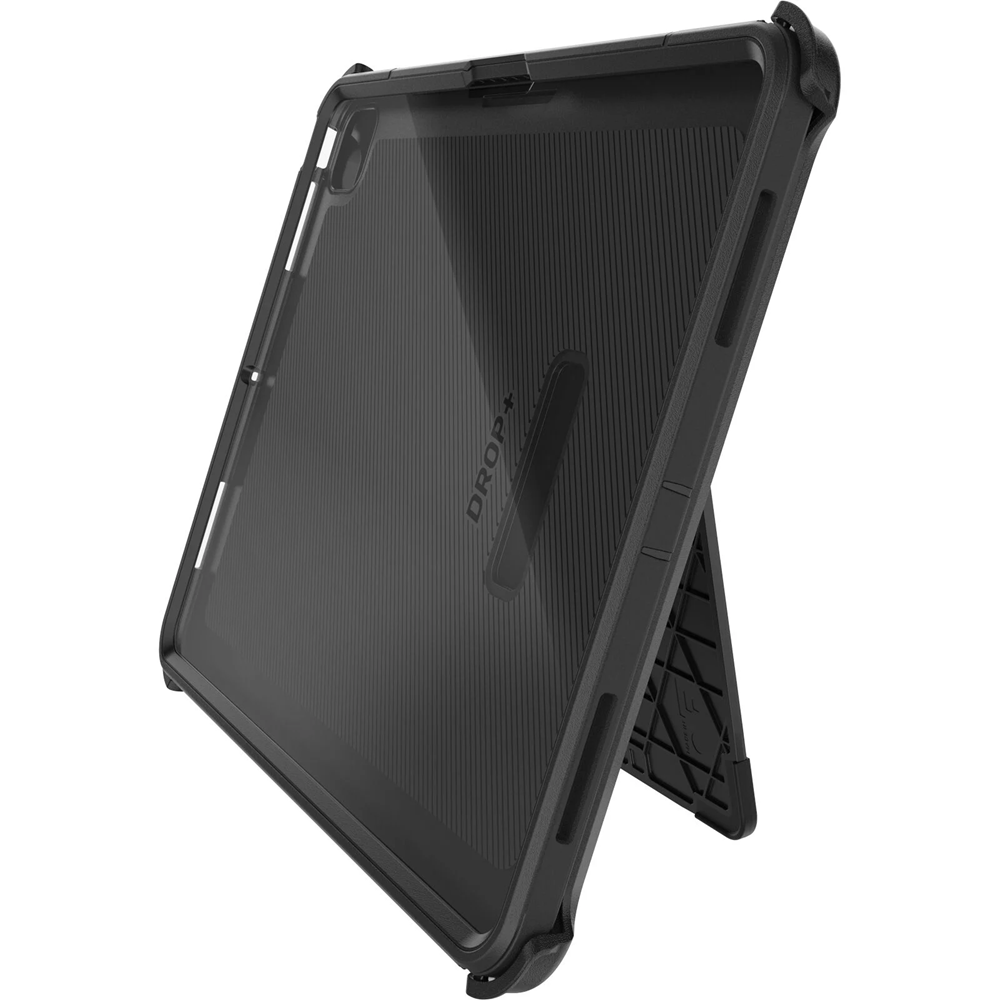 The OtterBox Defender Case for iPad Pro 13-inch (M4/M5) by Otterbox is shown propping up a tablet in landscape mode, featuring reinforced corners, a textured back with "DROP," and a built-in kickstand.