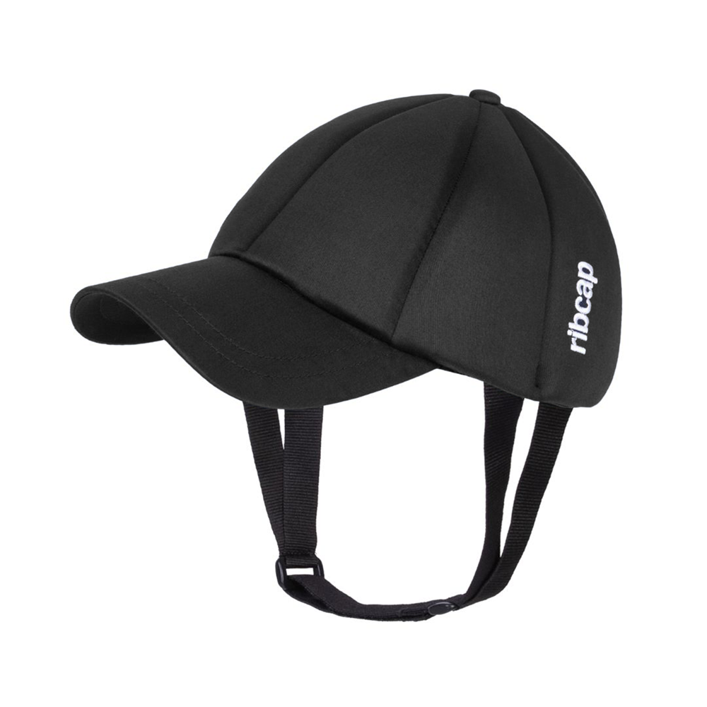 The Ribcap Baseball Cap [Black] by Ribcap features soft panels, chin straps, and subtle "ribcap" branding in white—delivering discreet, stylish head protection as a baseball-style medical helmet.