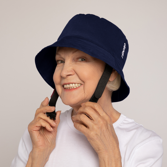 A person wearing a Ribcap Billie Hat in navy blue