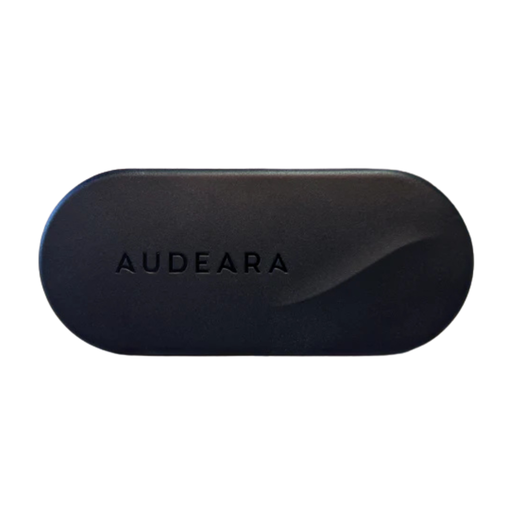 A black, oval Audeara Broadcaster (Auracast™ Transmitter) case with "AUDEARA" embossed on top, designed for inclusive listening, shown against a white background.