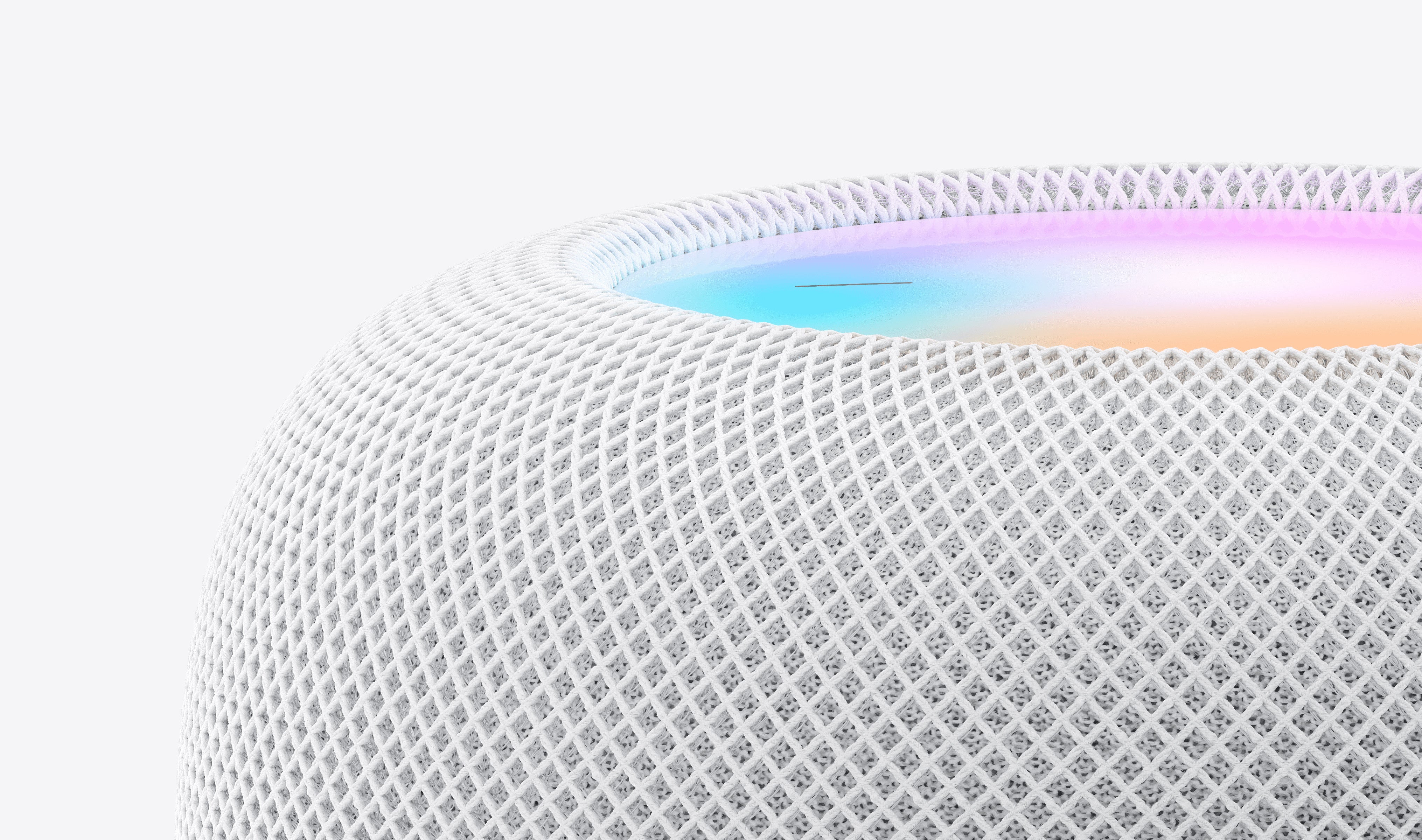 A close-up of the Apple HomePod (2nd Gen) [White], featuring a mesh exterior and a glowing, multicolored touch surface—ideal for seamless Siri integration in your smart home.