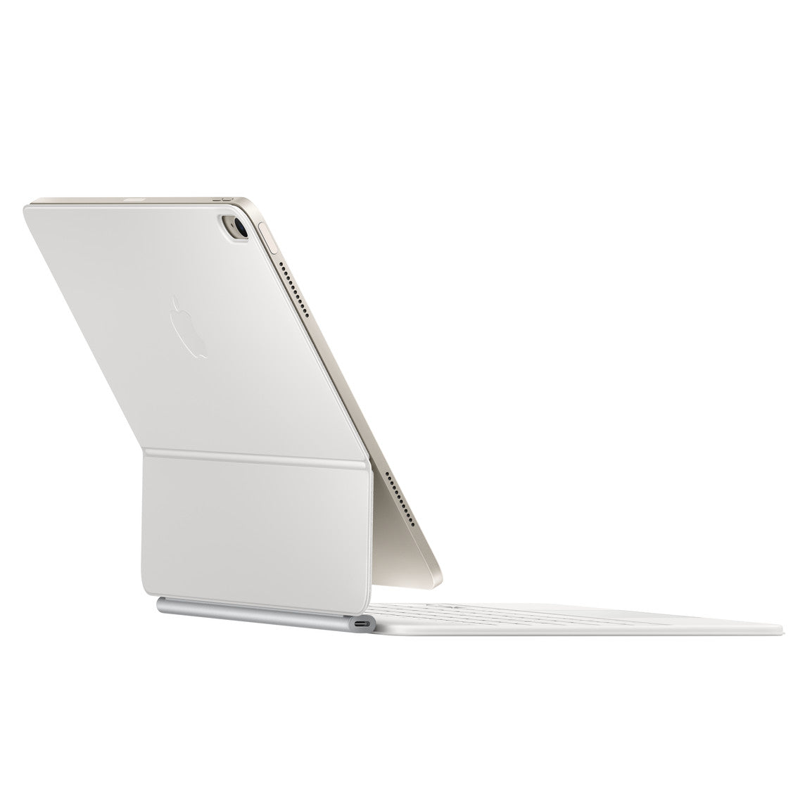 An Apple Magic Keyboard for iPad Air 13-inch (M3/M4) in US English is propped open on a flat surface with its backlit keyboard and the backside of the device visible, angled slightly to the left.