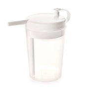 The Rika Novo Cup is a clear plastic drinking aid with a handle and a white spill-proof lid featuring a built-in spout and cap—ideal for bedridden users.