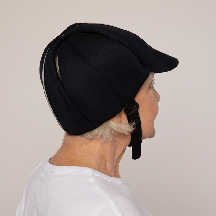 A person wearing a Ribcap protective headgear with a beanie