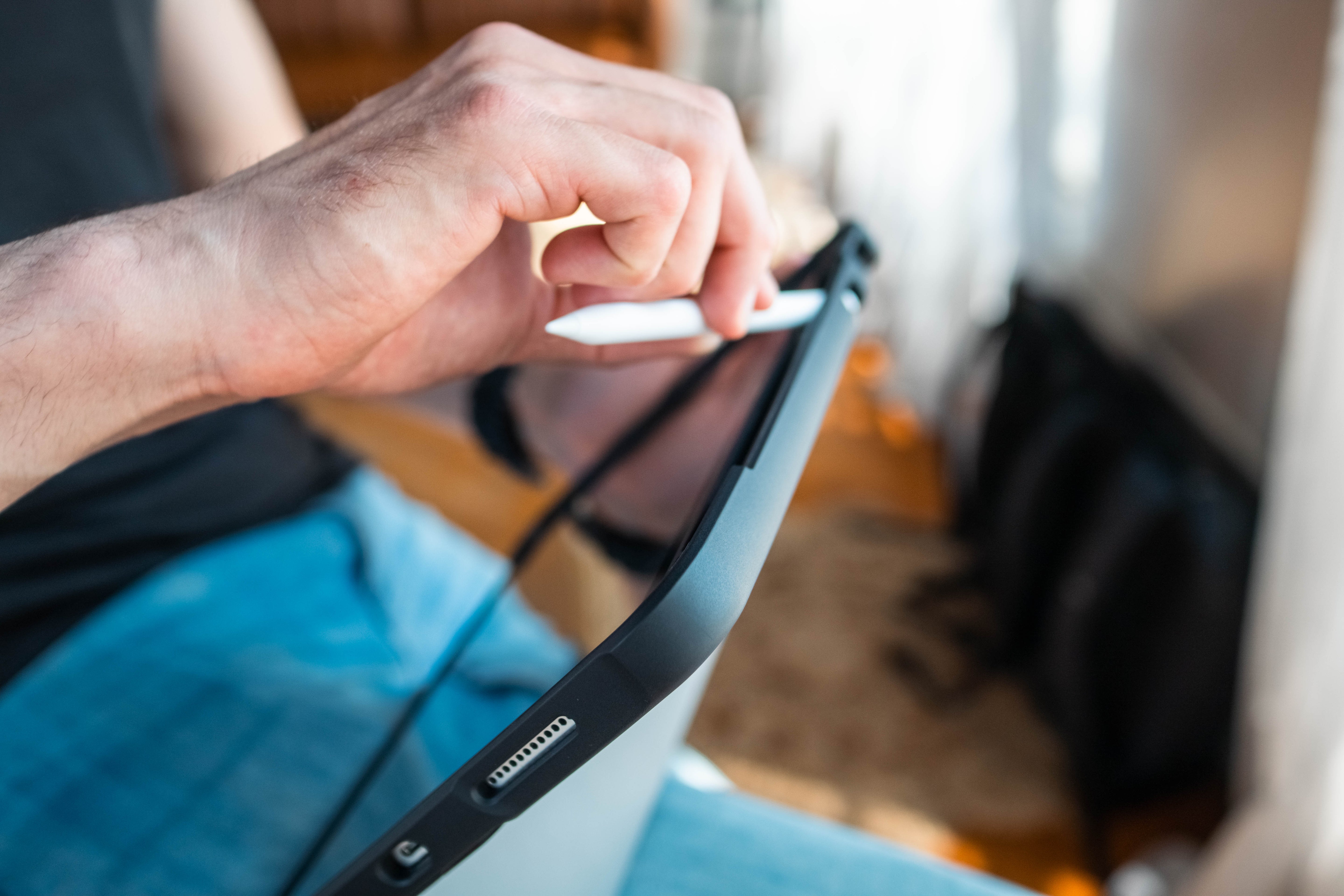 Person holding a smartphone with a blurred background