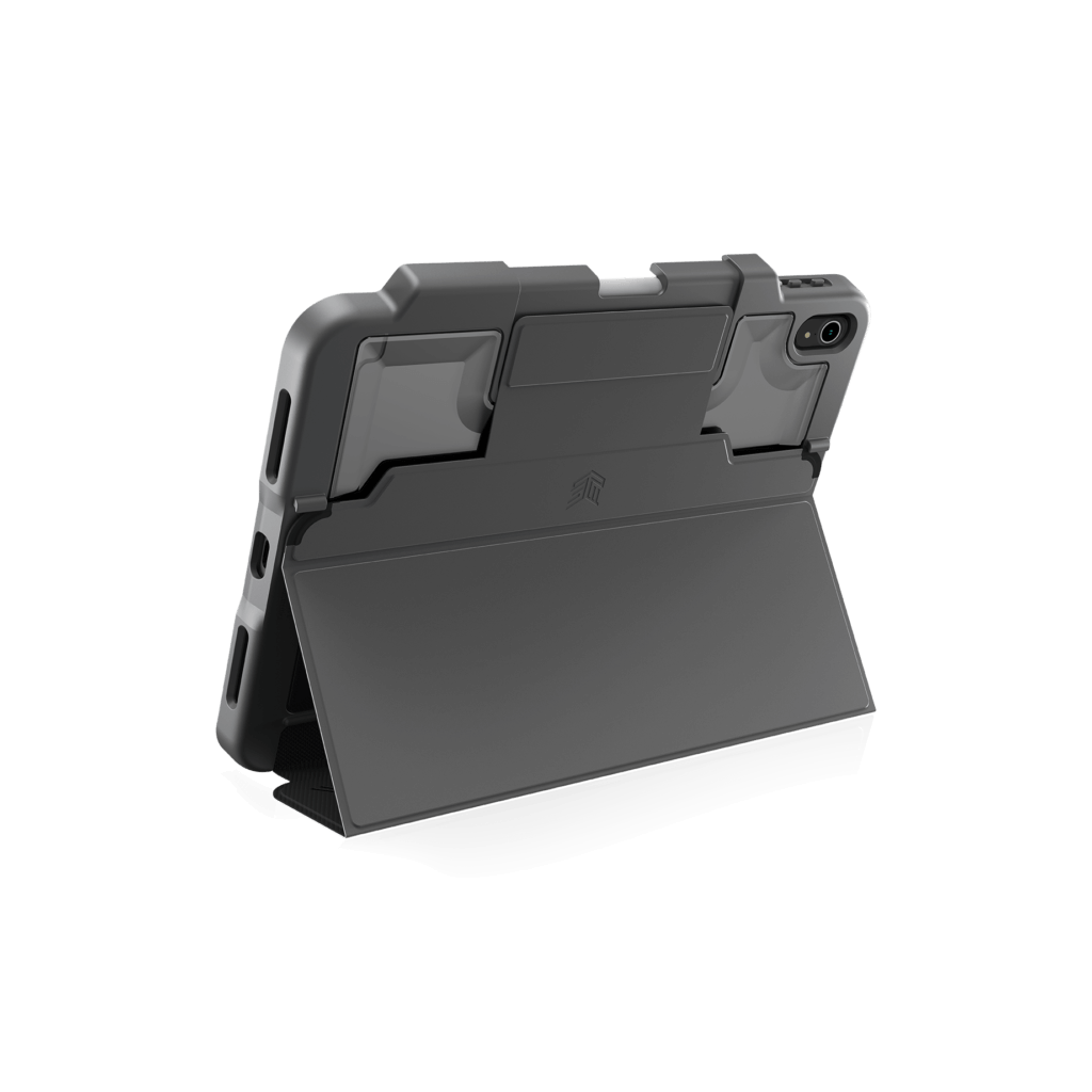 The STM Dux Plus Case [Black] for iPad A16/10th/11th Gen features military-grade drop protection, reinforced corners, a built-in kickstand, precise cutouts, and Apple Pencil storage—shown propping up an iPad on a white background.