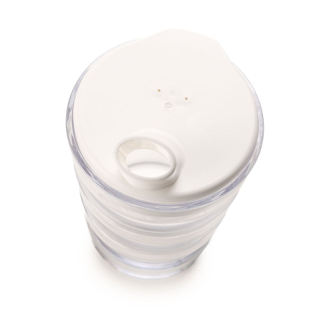 A Rika Drinking Cap (Large Hole) is shown atop a Sure Grip Mug (sold separately), filled with water. The white lid has a large drinking hole and two vent holes, as viewed from above on a white background.