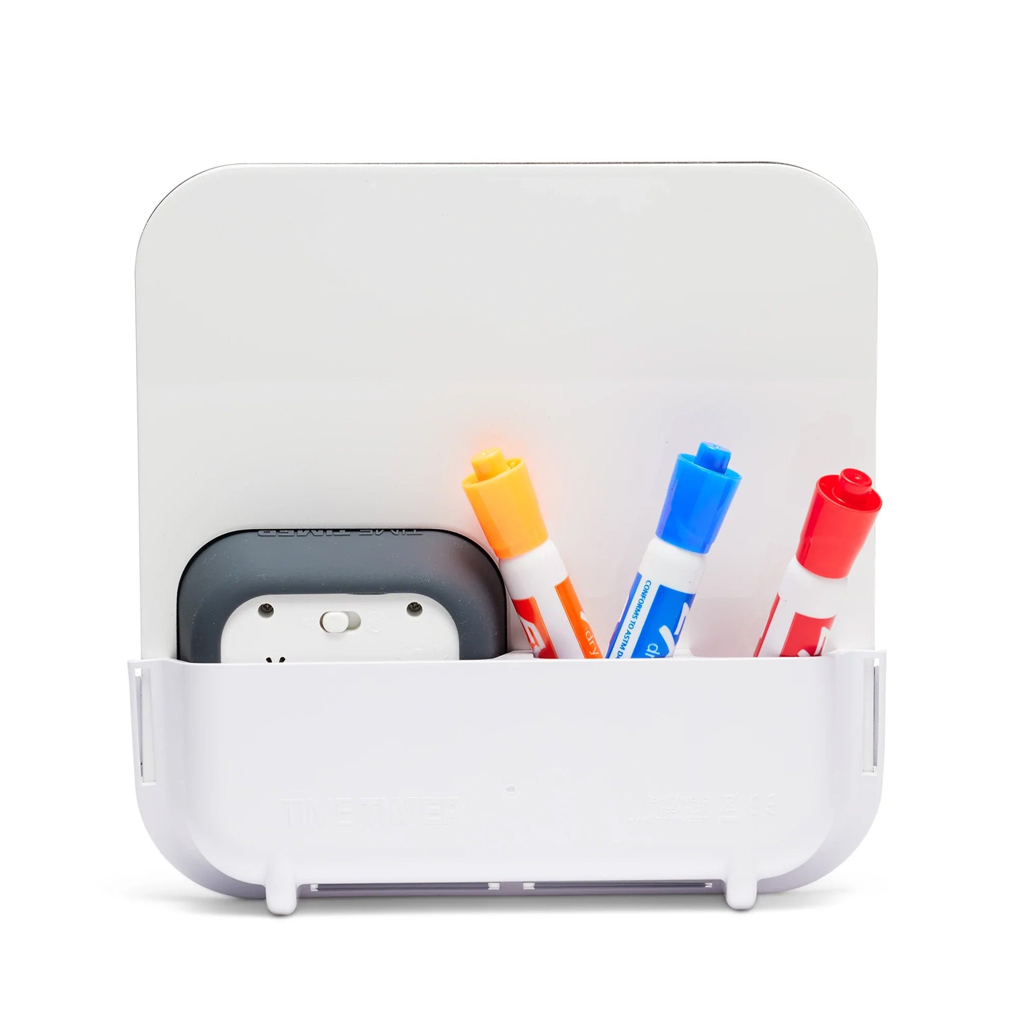 The Time Timer MOD with Whiteboard by Time Timer holds a magnetic dry erase board, three colored markers (orange, blue, red), and a black visual timer, all arranged neatly against a plain white background.