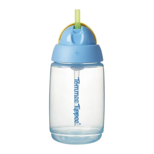 The Tommee Tippee Active Straw Cup 390mL is a BPA-free clear plastic toddler cup with a blue lid, yellow handle, and green straw. The brand name appears vertically on the side. Suitable for ages 12m+, it is leak-proof.