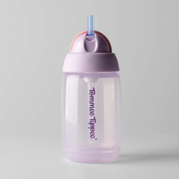 A translucent purple Tommee Tippee Active Straw Cup 390mL with a blue straw and pink-purple lid is shown on a light gray background. BPA-free and designed for kids on the go, by Tommee Tippee.