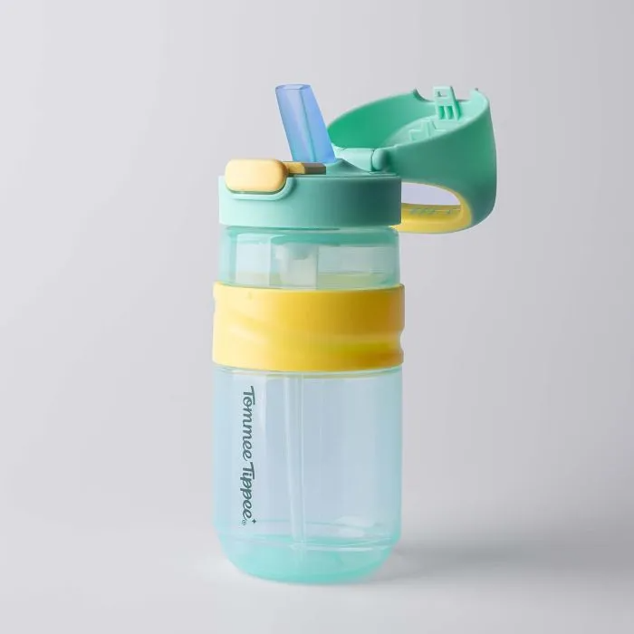 A light blue and yellow Tommee Tippee On-the-Go Straw Cup 500mL stands upright on a white background. This BPA-free, leak-proof toddler cup features a flip-top lid and built-in straw.