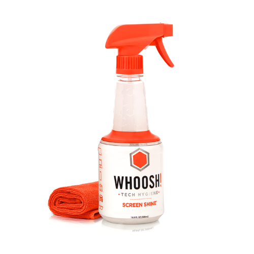 WHOOSH! Screen Shine spray bottle with orange microfibre cloth on a white background, showing a simple, safe way to clean screens and devices without streaks or fingerprints.