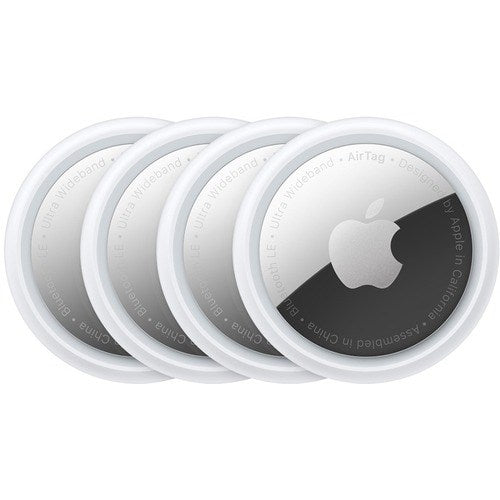Four Apple AirTag (4 Pack) trackers by Apple are shown overlapping in a row, each with a white ring and silver center featuring the Apple logo—ideal for tracking your items via the Find My app.