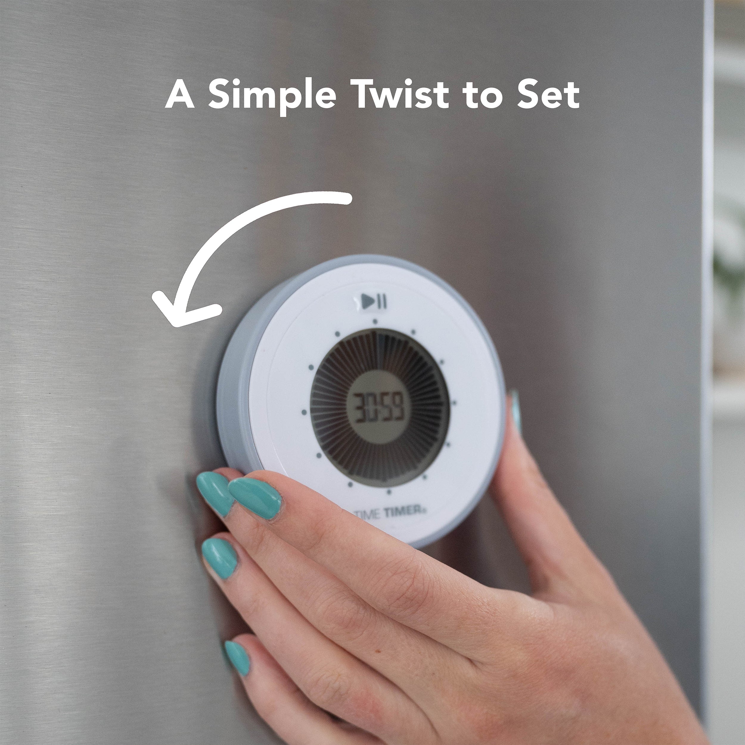 A hand with teal nails twists the Time Timer Twist (Pale Shale) by Time Timer on a stainless steel surface. The display shows 30:59, with text above reading "A Simple Twist to Set" and an arrow pointing to the visual timer.