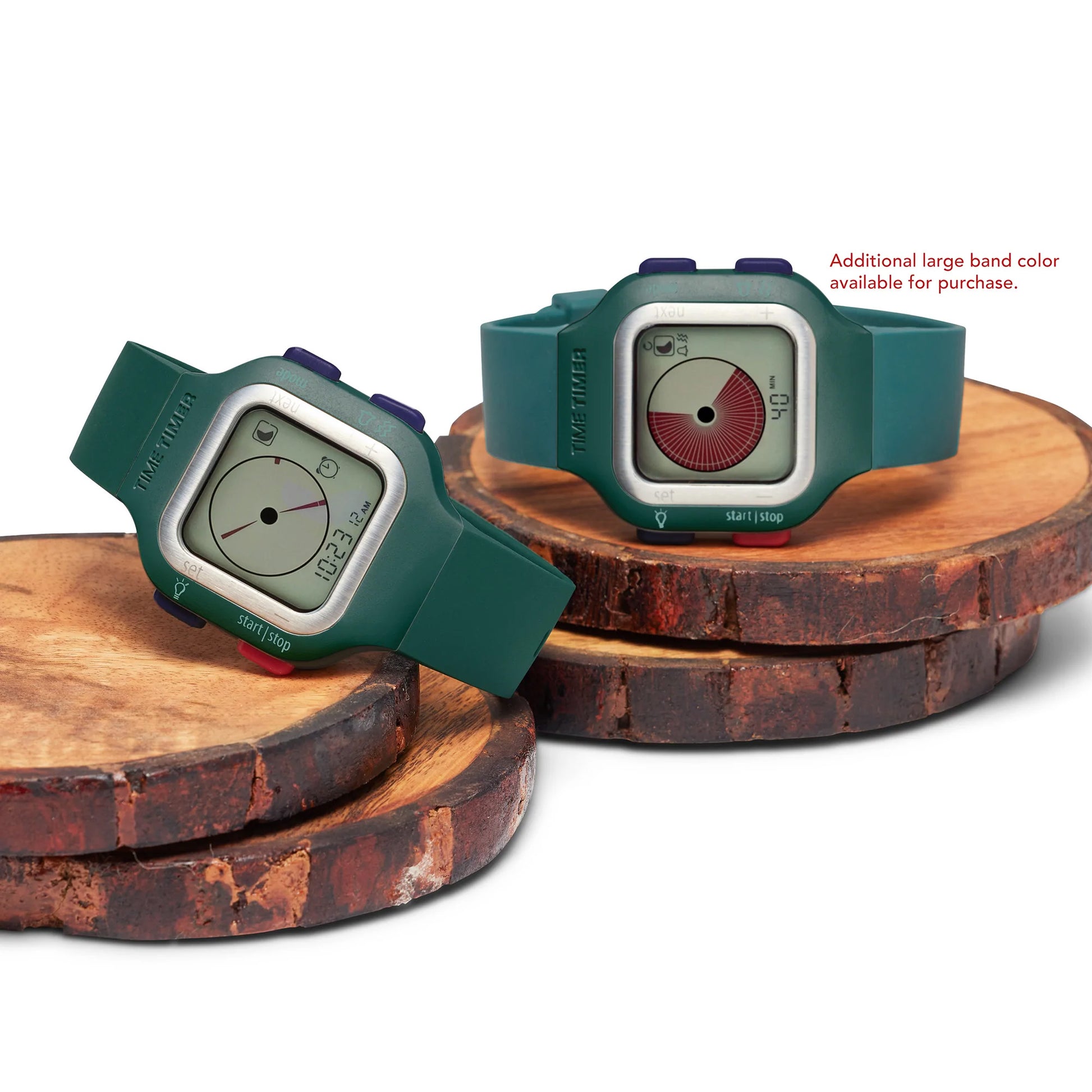 Two Time Timer Watch (Large/Adult) digital productivity watches by Time Timer, featuring green bands and rectangular faces, are displayed on round wooden platforms. An extra band color for the Time Timer Watch is also available for purchase.
