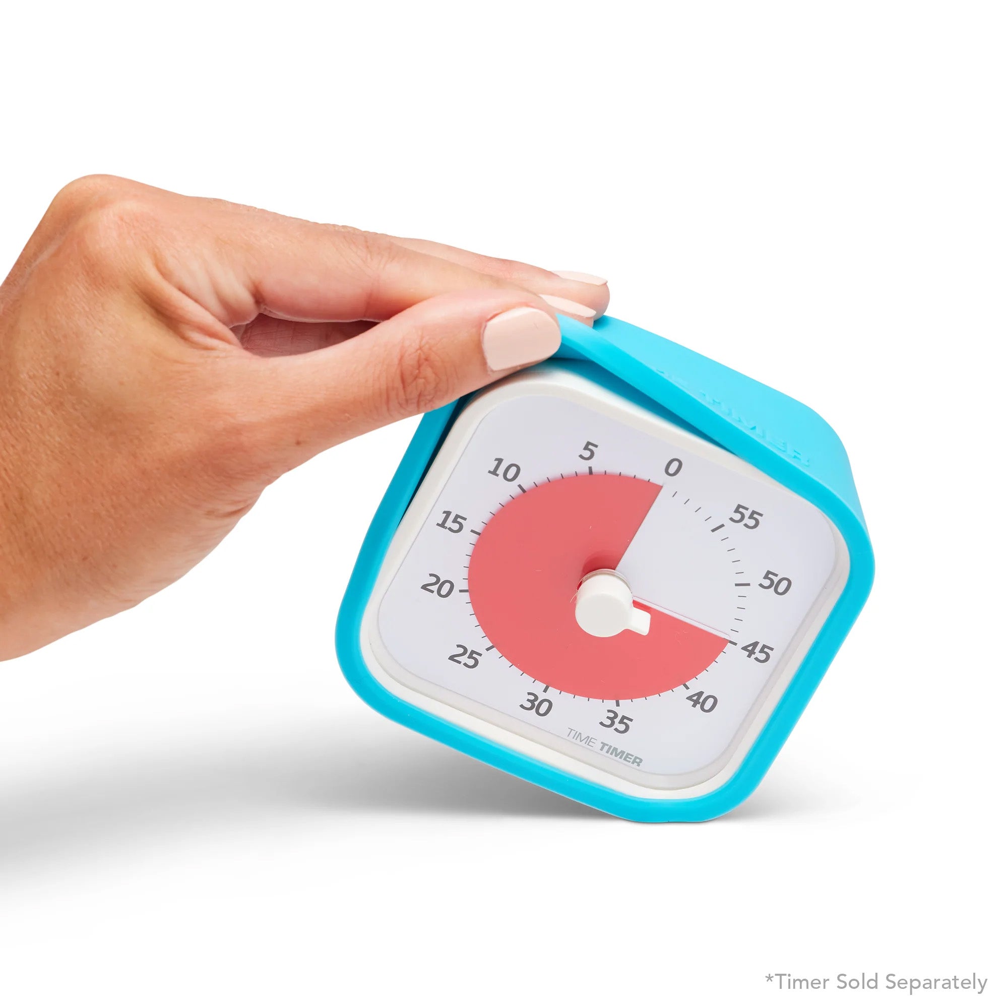 A hand with light skin holds a blue Time Timer MOD featuring a white face, red countdown area showing 33 minutes left, and a protective silicone cover accessory by Time Timer.