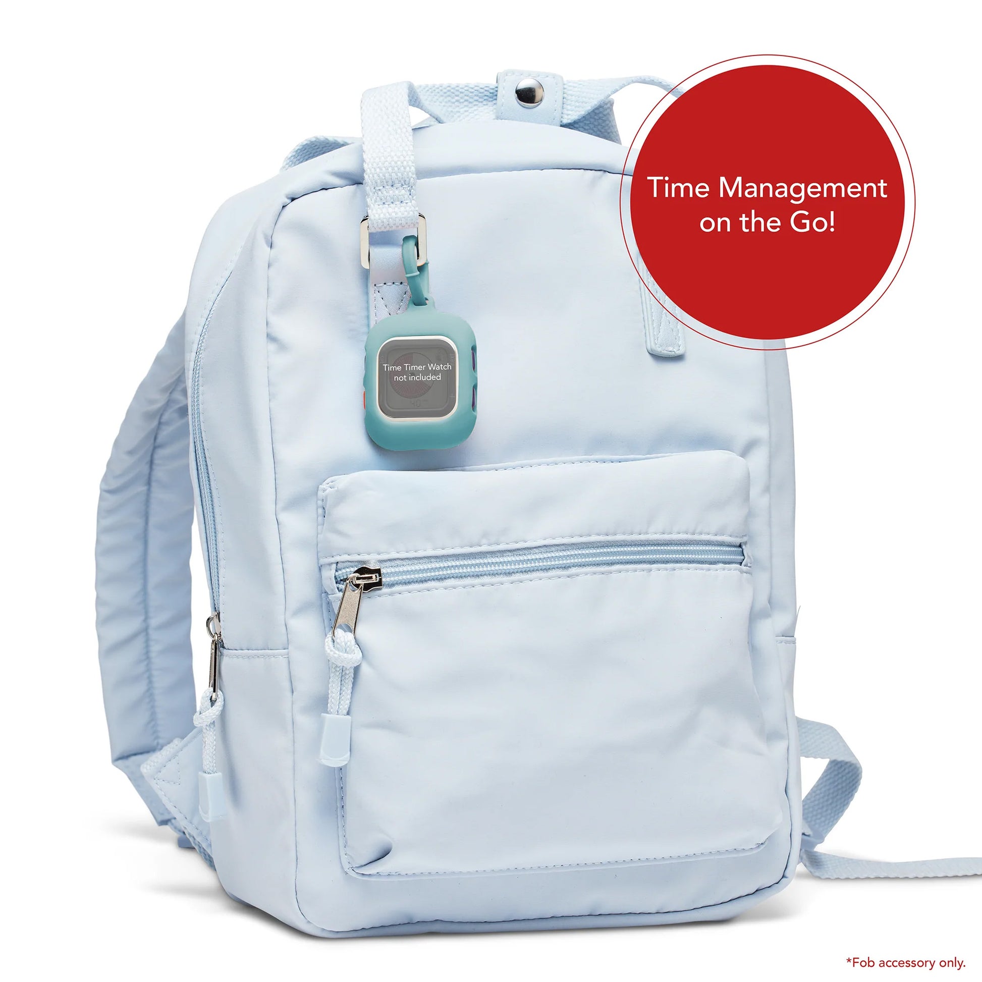 A Time Timer Watch Fob Case by Time Timer is attached to a light blue backpack strap. A red circle says "Time Management on the Go!" in white. Small print reads: *Fob accessory only—perfect for ADHD timer needs.