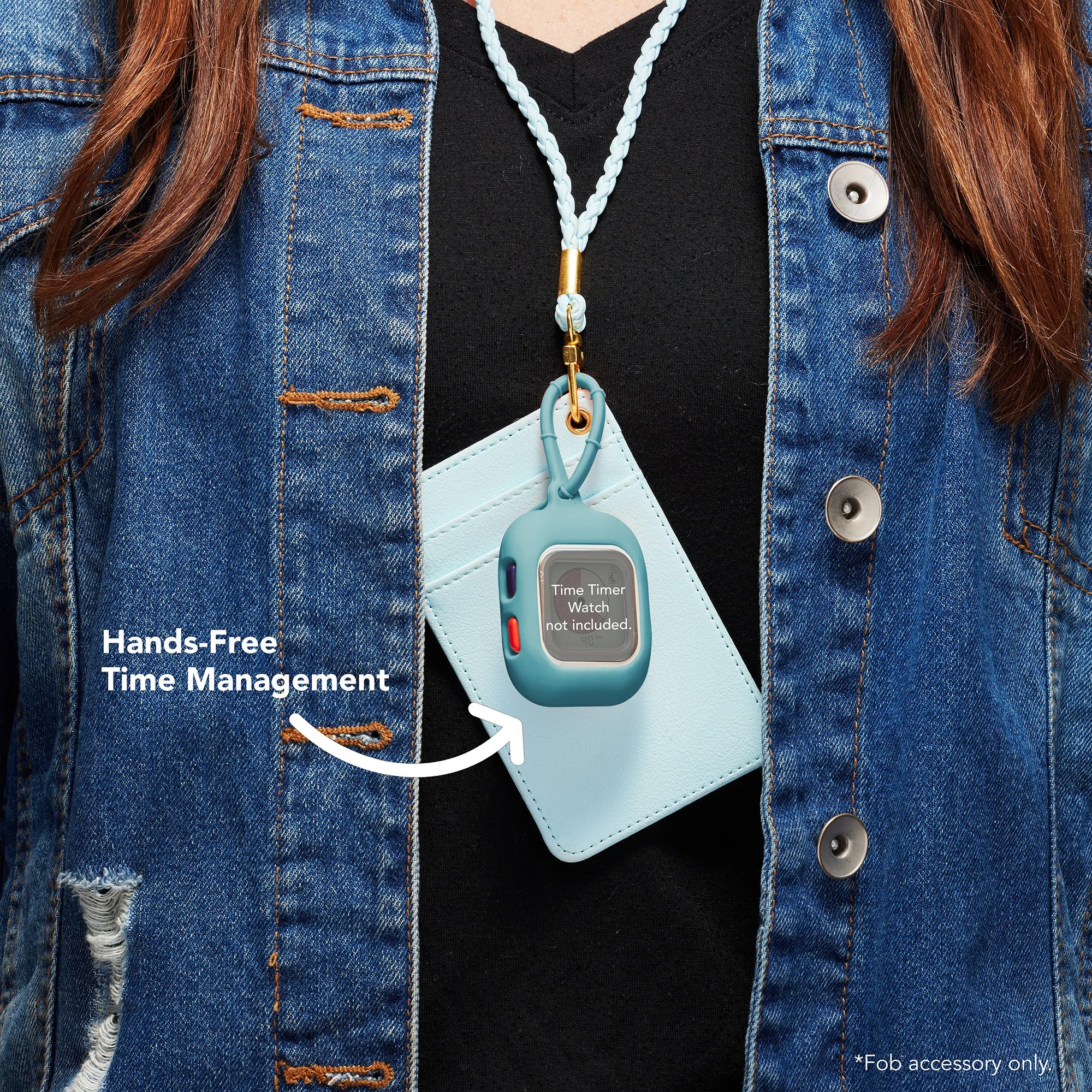 Wearing a denim jacket and black shirt, someone has a blue card holder and the Time Timer Watch Fob Case from Time Timer for their ADHD timer hanging on a lanyard. Text reads: “Hands-Free Time Management.”.