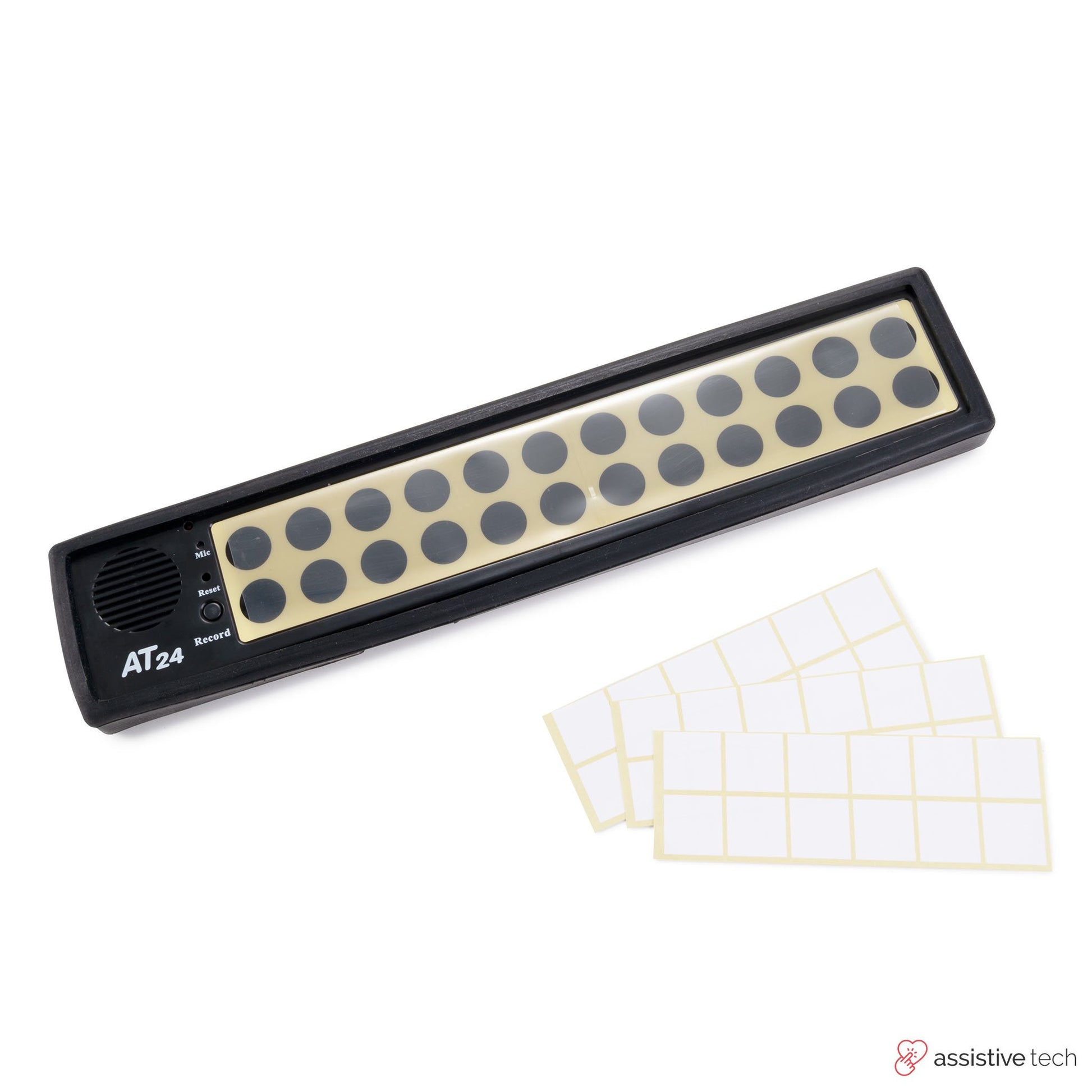 The Attainment 24 Talker with Glove by Attainment, a black AAC device with large buttons, is pictured next to blank white label stickers. This assistive technology helps users communicate more easily.