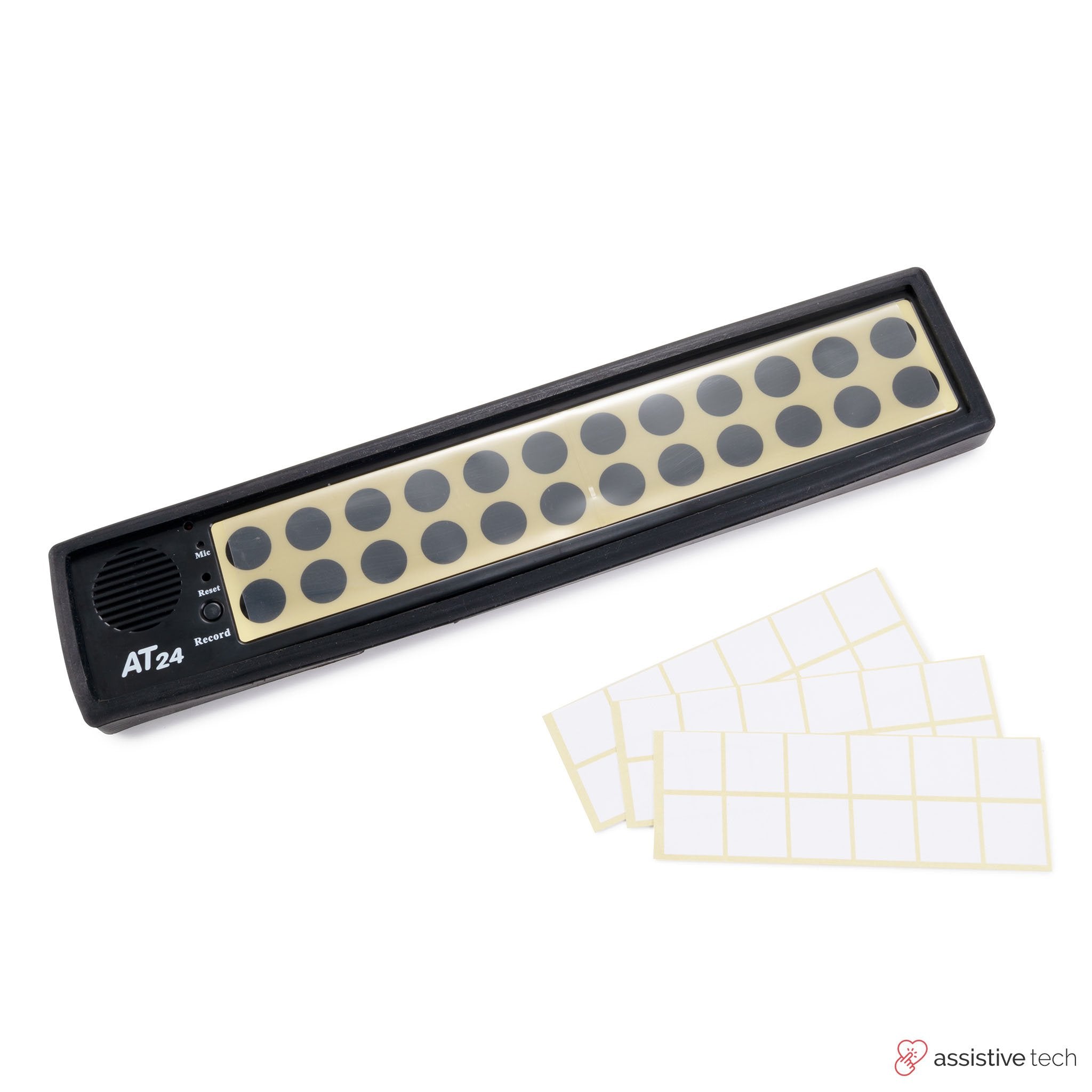 The Attainment 24 Talker with Glove by Attainment, a black AAC device with large buttons, is pictured next to blank white label stickers. This assistive technology helps users communicate more easily.