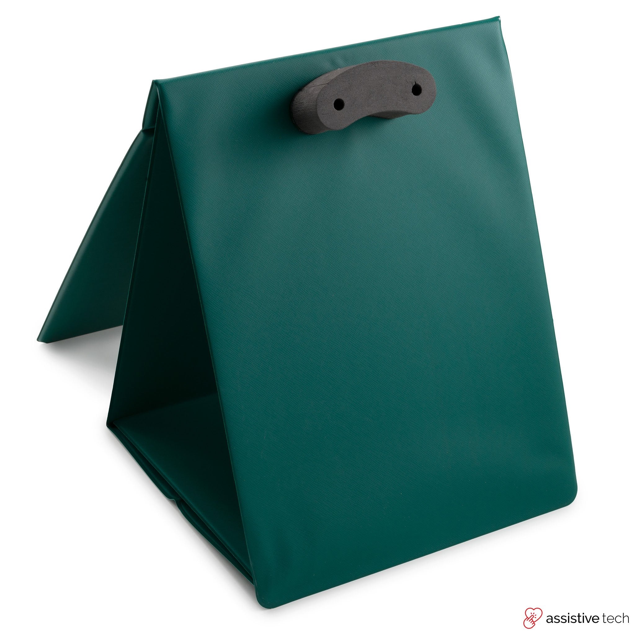 The GoTalk Carry Stand by Attainment is a green, triangular, foldable book stand with a black handle, NDIS approved and designed to support books or tablets with its padded, sturdy surface for stable upright use.