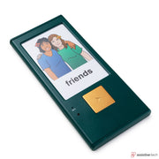 The GoTalk One by Attainment is a green AAC device featuring a screen with two smiling people and the word "friends," plus a large yellow button below for easy communication, highlighting assistive technology.